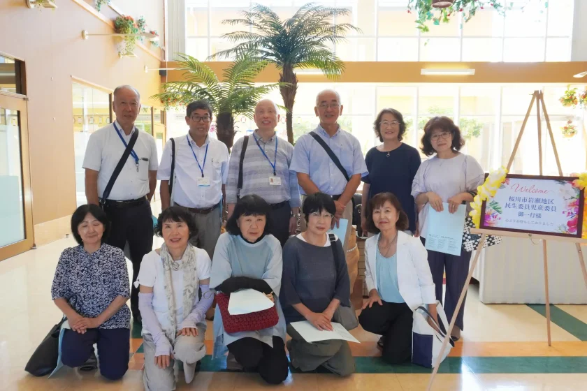 特養にて撮影された桜川市岩瀬地区民生委員児童委員の皆様と歓迎ボードの記念写真
